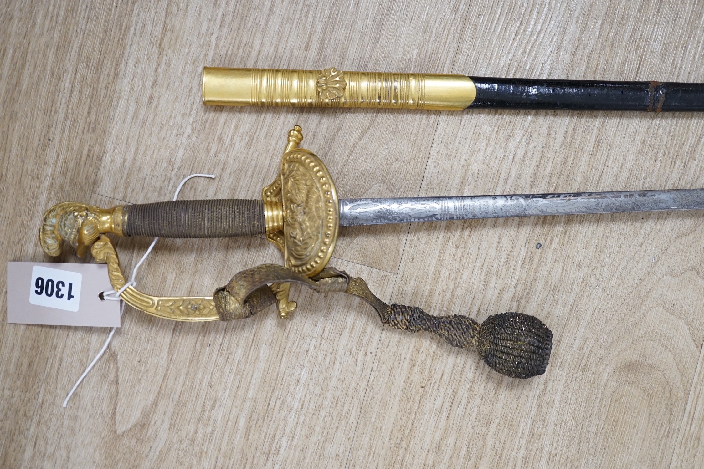 A 19th century officer's dress sword, made by Silver &Co. London with scabbard and leather cover